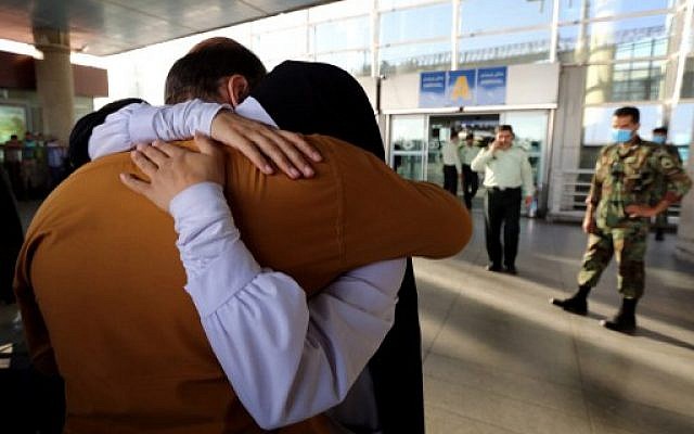 An Iranian woman cries as she hugs her husband at the Imam Khomeini international airport in Tehran following her return from the hajj pilgrimage in Saudi's holy Muslim city of Mecca, September 29, 2015. (AFP/ATTA KENARE) An Iranian woman cries as she hugs her husband at the Imam Khomeini international airport in Tehran following her return from the hajj pilgrimage in Saudi's holy Muslim city of Mecca, September 29, 2015. (AFP/ATTA KENARE)