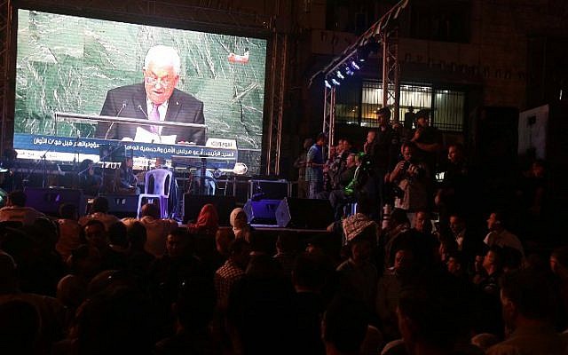 Palestinians watch the speech of PA President Mahmoud Abbas on a giant screen in Ramallah as he addresses the world at the United Nations headquarters in New York on September 30, 2015. (AFP/Jaafar Ashtiyeh) Palestinians watch the speech of PA President Mahmoud Abbas on a giant screen in Ramallah as he addresses the world at the United Nations headquarters in New York on September 30, 2015. (AFP/Jaafar Ashtiyeh)