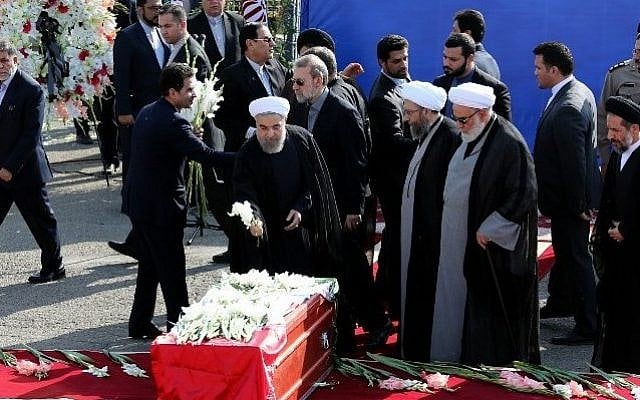 Iranian President Hassan Rouhani (center) places flowers on the caskets of Iranian pilgrims, killed in a stampede at the annual hajj, during a repatriation ceremony upon their arrival on October 3, 2015 at Tehran's Mehrabad Airport. (AFP PHOTO/ATTA KENARE) Iranian President Hassan Rouhani (center) places flowers on the caskets of Iranian pilgrims, killed in a stampede at the annual hajj, during a repatriation ceremony upon their arrival on October 3, 2015 at Tehran's Mehrabad Airport. (AFP PHOTO/ATTA KENARE)