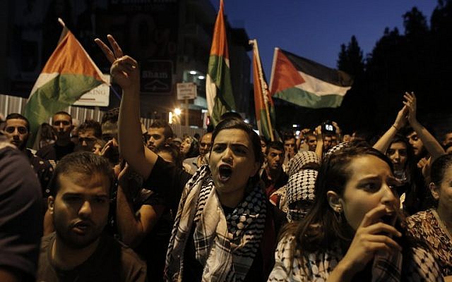 Israeli-Arab protesters shout slogans during a rally in support of the Palestinian people in the northern Israeli city of Nazareth, October 8, 2015. (AFP/AHMAD GHARABLI) Israeli-Arab protesters shout slogans during a rally in support of the Palestinian people in the northern Israeli city of Nazareth, October 8, 2015. (AFP/AHMAD GHARABLI)