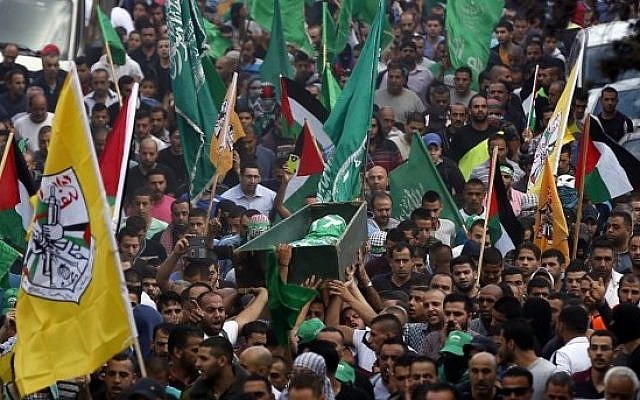 Palestinian men carry the body of 22-year-old Ahmad Qali, who was killed during clashes with Israeli security forces, during his funeral in the Shuafat refugee camp in East Jerusalem, on October 10, 2015 (Ahmad Gharabli/AFP) Palestinian men carry the body of 22-year-old Ahmad Qali, who was killed during clashes with Israeli security forces, during his funeral in the Shuafat refugee camp in East Jerusalem, on October 10, 2015 (Ahmad Gharabli/AFP)