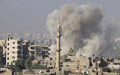 A picture shows smoke billowing following a reported Syrian regime bombings on rebel positions in Jobar, in eastern Damascus, on October 15, 2015. (Ammar Suleiman/AFP) A picture shows smoke billowing following a reported Syrian regime bombings on rebel positions in Jobar, in eastern Damascus, on October 15, 2015. (Ammar Suleiman/AFP)