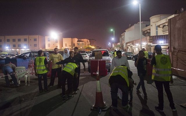 Illustrative: Saudi Shiite worshipers are frisked by members of security as they make their way to a hussainiya, a Shiite hall used for commemorations, in the mainly Shiite coastal town of Qatif, on October 16, 2015. (AFP/Hussein Radwan) Illustrative: Saudi Shiite worshipers are frisked by members of security as they make their way to a hussainiya, a Shiite hall used for commemorations, in the mainly Shiite coastal town of Qatif, on October 16, 2015. (AFP/Hussein Radwan)