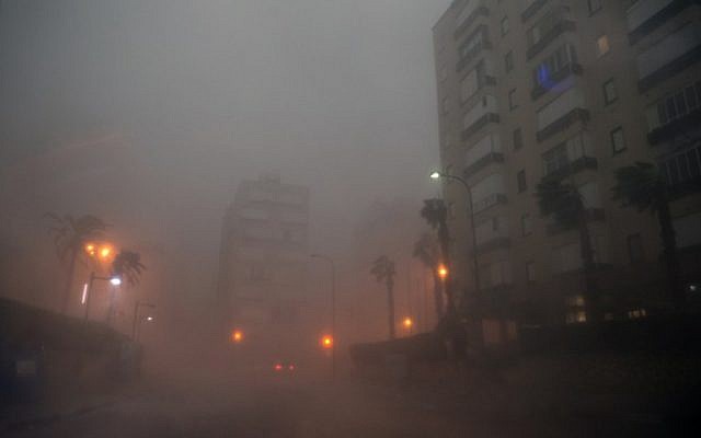 Cars drive through the haze in the Israeli Mediterranean town of Netanya, north of Tel Aviv on October 25, 2015 as a storm hits the area.(AFP/ JACK GUEZ) Cars drive through the haze in the Israeli Mediterranean town of Netanya, north of Tel Aviv on October 25, 2015 as a storm hits the area.(AFP/ JACK GUEZ)