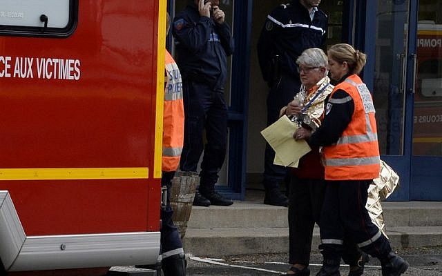 Emergency services personnel escort people away from the site of a deadly collision on October 23, 2015 in Puisseguin, near Libourne, southwestern France. (AFP PHOTO/JEAN-PIERRE MULLER) Emergency services personnel escort people away from the site of a deadly collision on October 23, 2015 in Puisseguin, near Libourne, southwestern France. (AFP PHOTO/JEAN-PIERRE MULLER)