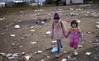 Migrant children arrive at the registration camp after crossing the Greek-Macedonian border near Gevgelija on October 29, 2015. (Nikolay Doychinov/AFP) Migrant children arrive at the registration camp after crossing the Greek-Macedonian border near Gevgelija on October 29, 2015. (Nikolay Doychinov/AFP)