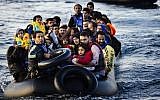 File: Migrants and refugees arrive on a dinghy on the Greek island of Lesbos, after crossing the Aegean sea from Turkey, on October 14, 2015. (AFP Photo/Dimitar Dilkoff)