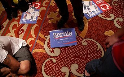 A campaign sign lies on the floor as supporters of Democratic presidential candidate Senator Bernie Sanders gather at a watch party for a presidential debate sponsored by CNN and Facebook in Las Vegas, October 13, 2015. (Photo by Alex Wong/Getty Images/AFP)