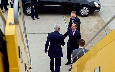 John Kerry shakes hands with US Ambassador to the Organization for Security and Cooperation in Europe Daniel Baer after arriving in Vienna, Austria, on October 29, 2015. (US State Department)