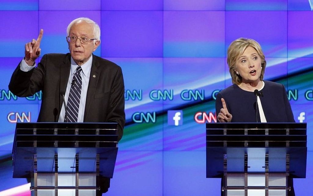 Sen. Bernie Sanders, of Vermont, left, speaks as Hillary Rodham Clinton looks on during the CNN Democratic presidential debate Tuesday, Oct. 13, 2015. (Photo by AP Photo/John Locher) Sen. Bernie Sanders, of Vermont, left, speaks as Hillary Rodham Clinton looks on during the CNN Democratic presidential debate Tuesday, Oct. 13, 2015. (Photo by AP Photo/John Locher)