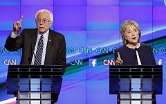 Sen. Bernie Sanders, of Vermont, left, speaks as Hillary Rodham Clinton looks on during the CNN Democratic presidential debate Tuesday, Oct. 13, 2015. (Photo by AP Photo/John Locher)