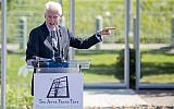 Former US president Bill Clinton speaks at the grand opening of an installation outside his presidential library honoring Anne Frank, Oct. 2, 2015, in Little Rock, Arkansas. The installation features a sapling from a tree outside the building where she and her family hid from the Nazis during World War II. (AP Photo/Gareth Patterson)