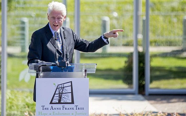 Former US president Bill Clinton speaks at the grand opening of an installation outside his presidential library honoring Anne Frank, Oct. 2, 2015, in Little Rock, Arkansas. The installation features a sapling from a tree outside the building where she and her family hid from the Nazis during World War II. (AP Photo/Gareth Patterson) Former US president Bill Clinton speaks at the grand opening of an installation outside his presidential library honoring Anne Frank, Oct. 2, 2015, in Little Rock, Arkansas. The installation features a sapling from a tree outside the building where she and her family hid from the Nazis during World War II. (AP Photo/Gareth Patterson)