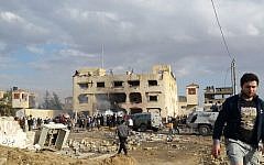 Illustrative: Egyptians gather at the scene following a bombing that struck a main police station in the capital of the northern Sinai province in el-Arish, Egypt, April 12, 2015. (Muhamed Sabry/AP)