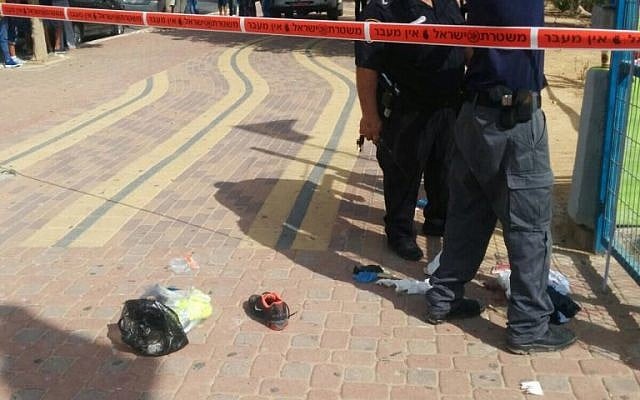 Israeli police at the scene where a Jewish man stabbed an Arab man in the southern city of Dimona on Friday, October 9, 2015. Three other Arab men were also injured in the attack. (Dimona Police Department) Israeli police at the scene where a Jewish man stabbed an Arab man in the southern city of Dimona on Friday, October 9, 2015. Three other Arab men were also injured in the attack. (Dimona Police Department)