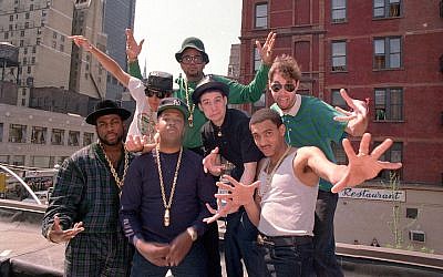 The Beastie Boys posing with Run-DMC atop a restaurant in midtown Manhattan, May 11, 1987. (Marty Lederhandler/AP Images)