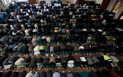 Illustrative: In this September 15, 2015 photo, men take part in prayers at the 7,000-worshiper capacity East London Mosque, the largest mosque in the United Kingdom. (AP Photo/Matt Dunham)