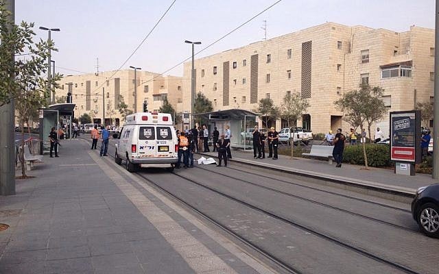 Rescue services at the scene of a stabbing attack in Jerusalem's Pisgat Zeev neighborhood on October 12, 2015. (Israel Police) Rescue services at the scene of a stabbing attack in Jerusalem's Pisgat Zeev neighborhood on October 12, 2015. (Israel Police)
