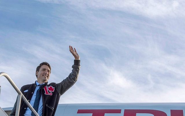 Liberal Leader Justin Trudeau waves as he boards his plane en route to Calgary, Sunday, Oct. 18, 2015 in Edmonton. (Paul Chiasson/The Canadian Press via AP) Liberal Leader Justin Trudeau waves as he boards his plane en route to Calgary, Sunday, Oct. 18, 2015 in Edmonton. (Paul Chiasson/The Canadian Press via AP)