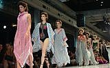 Yaron Minkowski's models draped in keffiyehs as a symbol of Fashion Week coexistence (Courtesy Idocvm and Mark Oren/TLV Fashion Mall)
