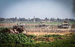 Illustrative: Israeli forces next to the security fence on the border between Israel and southern Gaza Strip. (Abed Rahim Khatib/Flash90)