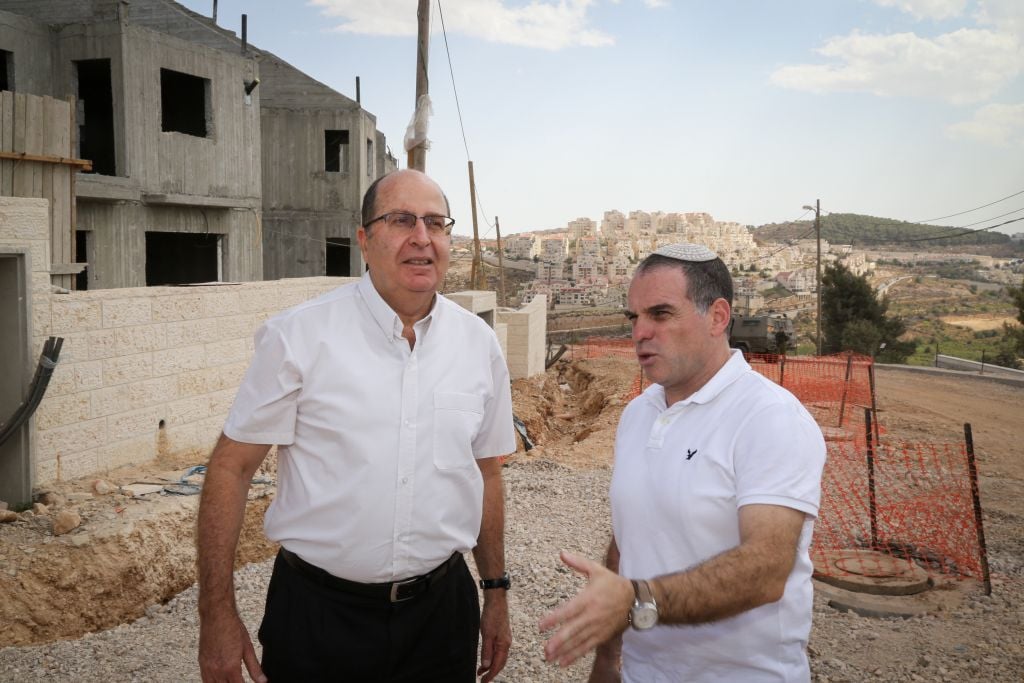 Defense Minister Moshe Ya'alon (left), with Efrat Mayor Oded Ravivi (right) in the Etzion Bloc settlement on September 30, 2015 (Gershon Elinson/Flash90) Defense Minister Moshe Ya'alon (left), with Efrat Mayor Oded Ravivi (right) in the Etzion Bloc settlement on September 30, 2015 (Gershon Elinson/Flash90)