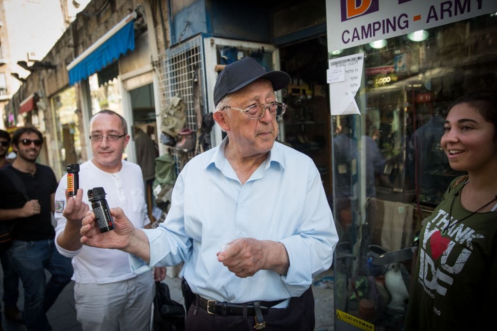 An older Israeli shows off his newly purchased pepper spray, in central Jerusalem (Hadas Parush/Flash 90) An older Israeli shows off his newly purchased pepper spray, in central Jerusalem (Hadas Parush/Flash 90)