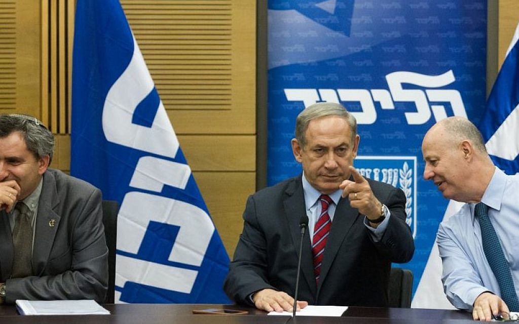 Benjamin Netanyahu, center, with Tzachi Hanegbi, right, and Zeev Elkin at a Likud faction meeting on October 19, 2015 (Miriam Alster/Flash90)