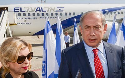Prime Minister Benjamin Netanyahu and his wife Sara, upon boarding their flight at Ben Gurion International Airport to Berlin, October 21, 2015. (Amos Ben Gershom/GPO)