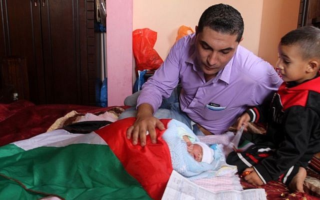 A Palestinian baby boy named 'Knife of Jerusalem' is wrapped in a Palestinian flag and displayed for members of the media, at his family's home in Rafah, southern Gaza, on October 24, 2015. (Abed Rahim Khatib/Flash90) A Palestinian baby boy named 'Knife of Jerusalem' is wrapped in a Palestinian flag and displayed for members of the media, at his family's home in Rafah, southern Gaza, on October 24, 2015. (Abed Rahim Khatib/Flash90)