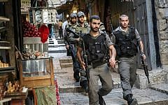 Border Police walk through the market near Jaffa Gate in Jerusalem's Old City, October 11, 2015. (Hadas Parush/Flash90)