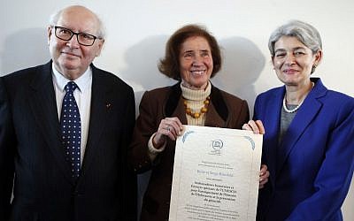 Serge Klarsfeld, 80 (left), French historian, lawyer and Holocaust survivor, and his 76-year-old German-born wife Beate Klarsfeld (right), along with the director-general of UNESCO, Irina Bokova, pose after being named UN special envoys and honorary ambassadors on genocide prevention at UNESCO headquarters in Paris, October 26, 2015. (AP/Francois Mori)
