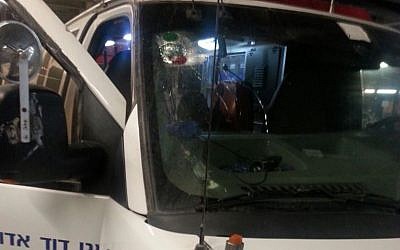 An ambulance sustained damage after being pelted with rocks near Hebron on October 3, 2015. (MADA)