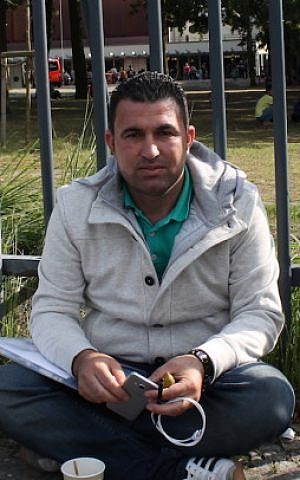 Idris Abdulah, a Syrian Kurd who arrived in Germany in 2014 and still hasn’t found a job, says he hopes one day to work helping refugees like himself. (Uriel Heilman/JTA) 