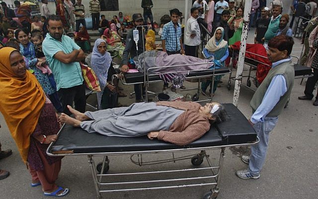 Patients who were shifted outdoors at the government medical college hospital after a strong tremor was felt in Jammu, India, Monday, Oct. 26, 2015. (Photo by AP Photo/Channi Anand) Patients who were shifted outdoors at the government medical college hospital after a strong tremor was felt in Jammu, India, Monday, Oct. 26, 2015. (Photo by AP Photo/Channi Anand)