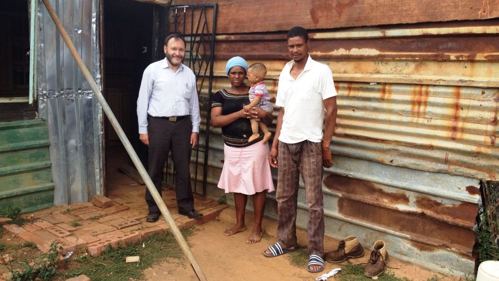 Jewish South African politician Jack Bloom (left) with his hosts Lucky and Lettie Mopeli at the Barrage settlement outside Johannesburg, South Africa. (Courtesy) Jewish South African politician Jack Bloom (left) with his hosts Lucky and Lettie Mopeli at the Barrage settlement outside Johannesburg, South Africa. (Courtesy)