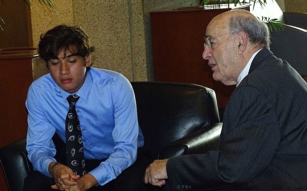Sebastian Espinoza-Carranza, left, who pleaded guilty to spray-painting anti-Semitic graffiti on a suburban Washington, D.C. synagogue, confers with his attorney, Barry Helfand, prior to his hearing, September 8, 2015. (Suzanne Pollak/via JTA) Sebastian Espinoza-Carranza, left, who pleaded guilty to spray-painting anti-Semitic graffiti on a suburban Washington, D.C. synagogue, confers with his attorney, Barry Helfand, prior to his hearing, September 8, 2015. (Suzanne Pollak/via JTA)