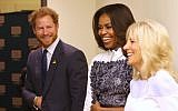 Britain's Prince Harry, first lady Michelle Obama and Jill Biden tour the USO Warrior and Family Center at the Fort Belvoir military base, Wednesday, Oct. 28, 2015, at Fort Belvoir, Va. The event is being held in support of the Invictus Games Orlando 2016. (AP Photo/Andrew Harnik)