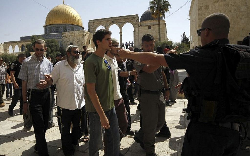 A group of religious Jews escorted by Israeli police visit the Temple Mount in Jerusalem, July 28, 2015. (AP/Mahmoud Illean)