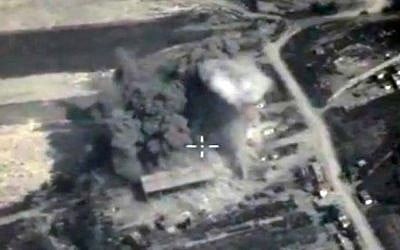 This file photo made from the footage taken from the Russian Defense Ministry official web site on Sunday, Oct. 4, 2015, an aerial view of a bomb explosion in Syria. (Russian Defense Ministry Press Service via AP, File)