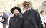 Morgan Freeman meeting with the rabbi of the Western Wall, Shmuel Rabinowitz, during a visit to the site on October 25, 2015. (Courtesy of the Western Wall Heritage Foundation)