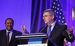 Kuwait's Sheikh Ahmad Al-Fahad Al-Sabah, president of the Association of National Olympic Committees (ANOC), listens at left as Thomas Bach, president of the International Olympic Committee, speaks during a meeting of the Association of Olympic Committees, Washington, October 29, 2015. (AP/Alex Brandon)