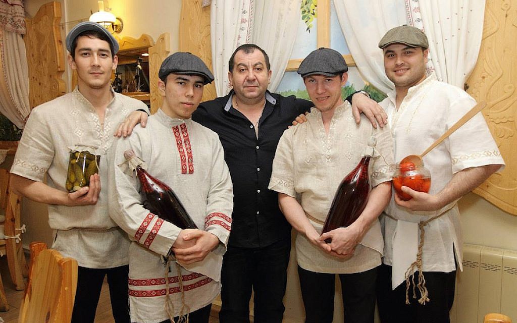 Pinhas Slobodkin, center, with staff at a Moscow event serving kosher food in 2014. (Courtesy of Slobodkin) Pinhas Slobodkin, center, with staff at a Moscow event serving kosher food in 2014. (Courtesy of Slobodkin)