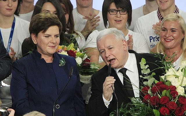 Conservative Law and Justice leader Jaroslaw Kaczynski and Justice candidate for the Prime Minister Beata Szydlo, left, deliver speeches at the party's headquarters in Warsaw, Poland, on Sunday, Oct. 25, 2015. The victory of Kaczynski's Eurosceptic party ends eight years in power of the pro-EU, pro-business Civic Platform which voters accuse of being conformist, detached and focused on power rather than on improving living standards in Poland.(AP Photo/Czarek Sokolowski) Conservative Law and Justice leader Jaroslaw Kaczynski and Justice candidate for the Prime Minister Beata Szydlo, left, deliver speeches at the party's headquarters in Warsaw, Poland, on Sunday, Oct. 25, 2015. The victory of Kaczynski's Eurosceptic party ends eight years in power of the pro-EU, pro-business Civic Platform which voters accuse of being conformist, detached and focused on power rather than on improving living standards in Poland.(AP Photo/Czarek Sokolowski)