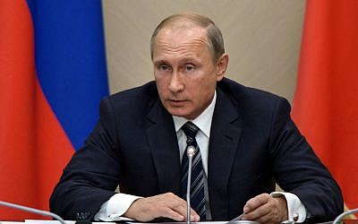 Russian President Vladimir Putin holds a meeting with senior government officials at the Novo-Ogaryovo residence outside Moscow, Russia on Wednesday, September 30, 2015. (Alexei Nikolsky/RIA Novosti, Kremlin Pool Photo via AP)