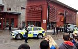 Emergency services attend the scene after a masked man attacked people with a sword, at the Kronan school in Trollhattan, near Goteborg in western Sweden, Thursday Oct. 22, 2015. (Stig Hedström/TT via AP)
