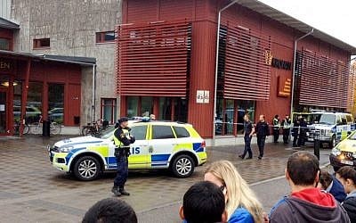 Emergency services attend the scene after a masked man attacked people with a sword, at the Kronan school in Trollhattan, near Goteborg in western Sweden, Thursday Oct. 22, 2015. (Stig Hedström/TT via AP)
