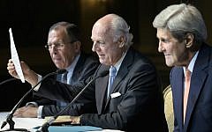 Russian Foreign Minister Sergei Lavrov, left, and Secretary of State John Kerry, right, listen as UN Special Envoy for Syria Staffan de Mistura speaks during a news conference in Vienna, Austria, Friday, October 30, 2015 (Brendan Smialowski/Pool via AP)