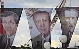 Banners (from left to right) of Turkish Prime Minister Ahmet Davutoglu, President Recep Tayyip Erdogan, and Turkish Republic founder Mustafa Kemal Ataturk, during a rally of supporters of Davutoglu in Istanbul, October 25, 2015. (AP/Lefteris Pitarakis, File)