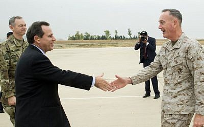US Ambassador to Iraq, Stuart E. Jones and U.S. Army Lt. Gen. Sean McFarland, left, greet Joint Chiefs Chairman Gen. Joseph Dunford Jr. upon his arrival at Irbil, Iraq, Tuesday, Oct. 19, 2015. (D. Myles Cullen/Pentagon via AP)